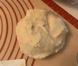 ball of shiny cubierta (coconut oil, flour, and sugar) on a mat