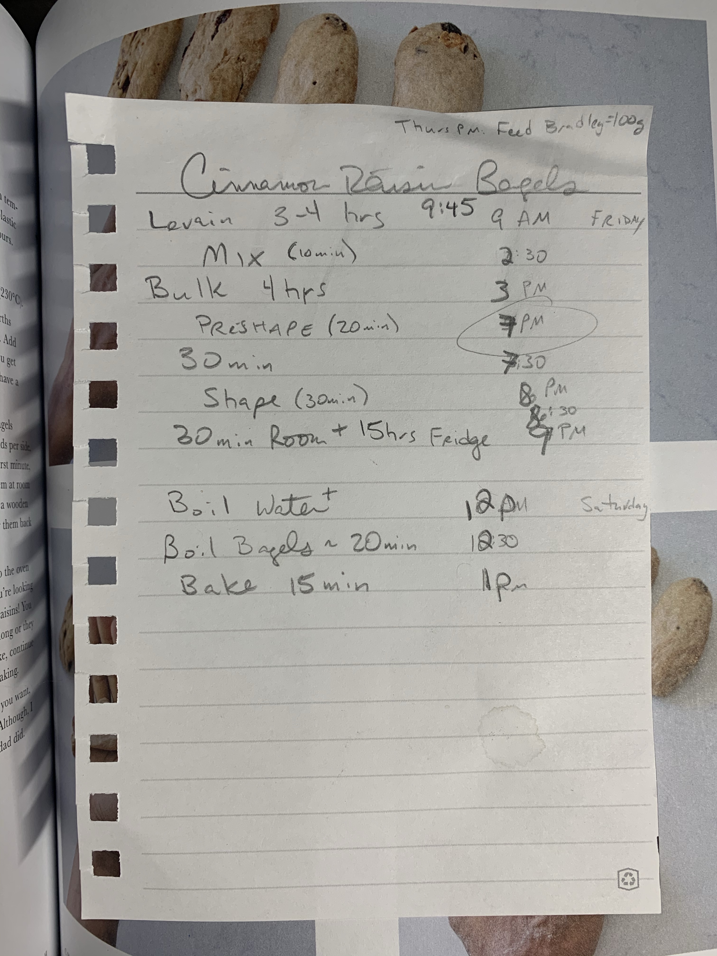 Notebook paper with penciled writing steps for bagels next to approximate times