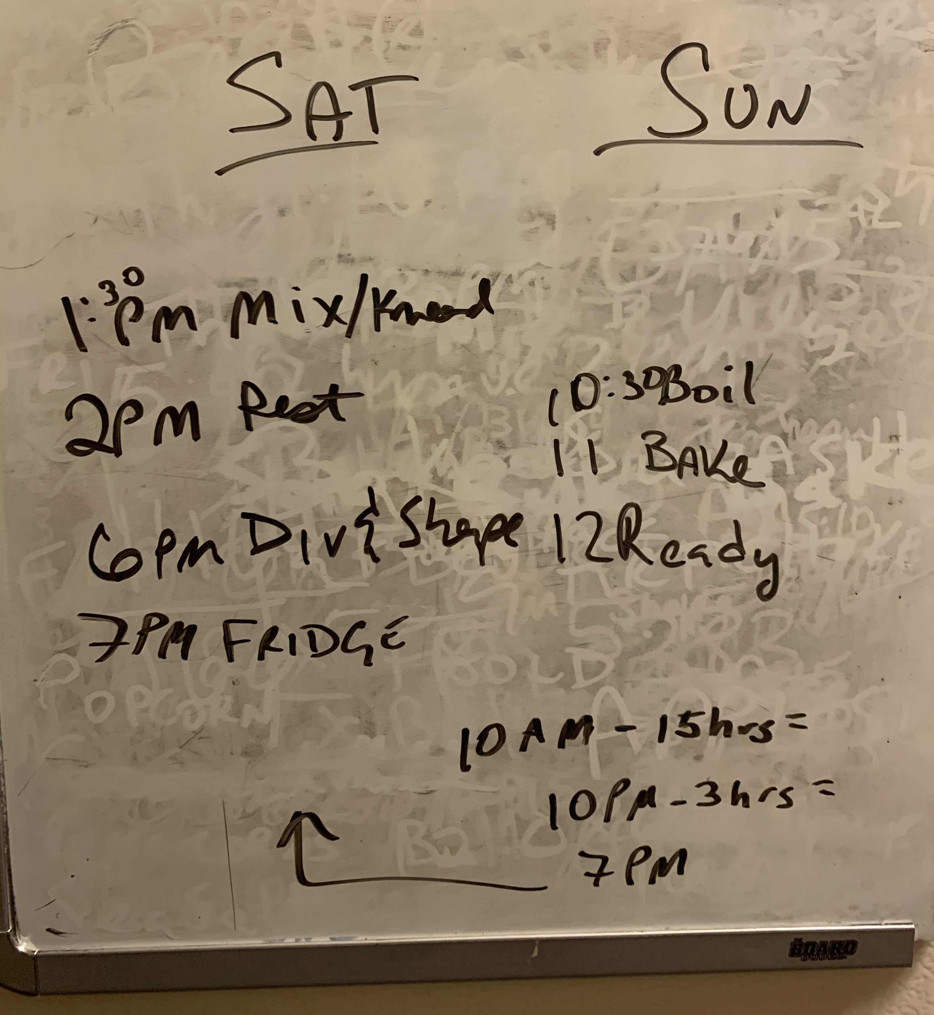dry erase board with timing and steps for baking written out