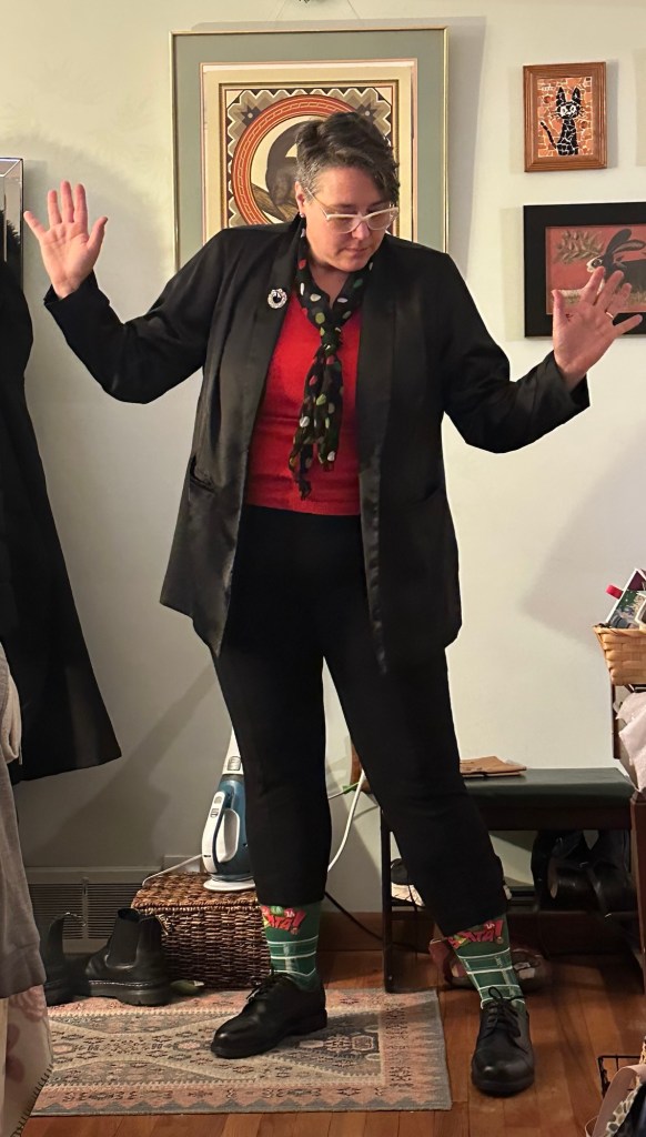 sarah wearing a black suit in our living room